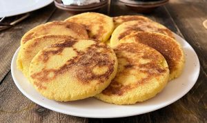 Traditional Moroccan harcha (semolina flatbread) served at Nomad Surf Camp in Tamraght, Morocco